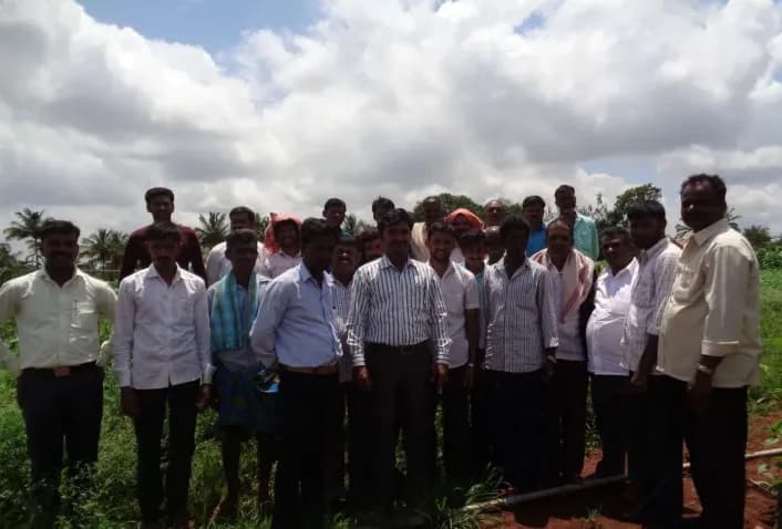 Farmers and the Royal CSP team standing together in a field